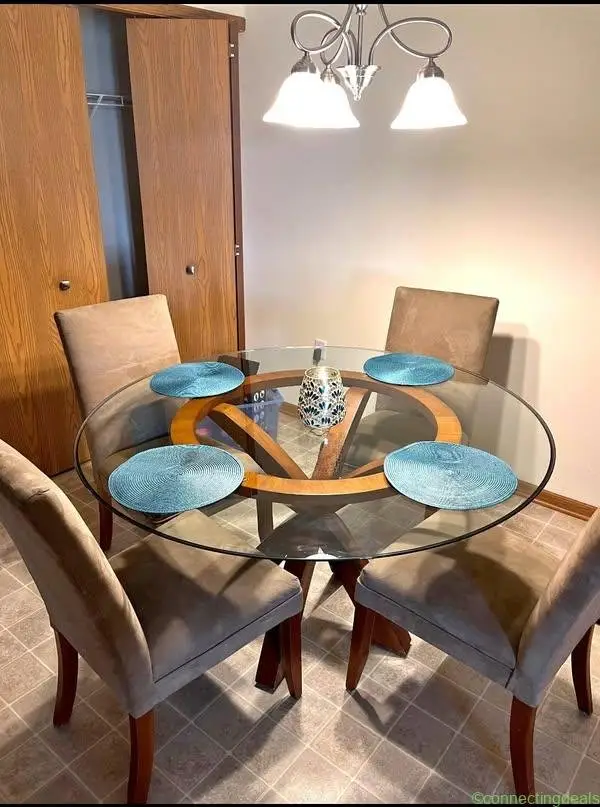 Glass top dining table, 55” around, 1/2” thick, 4