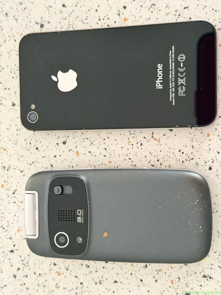 Old Apple & a Samsung mobile phones, from