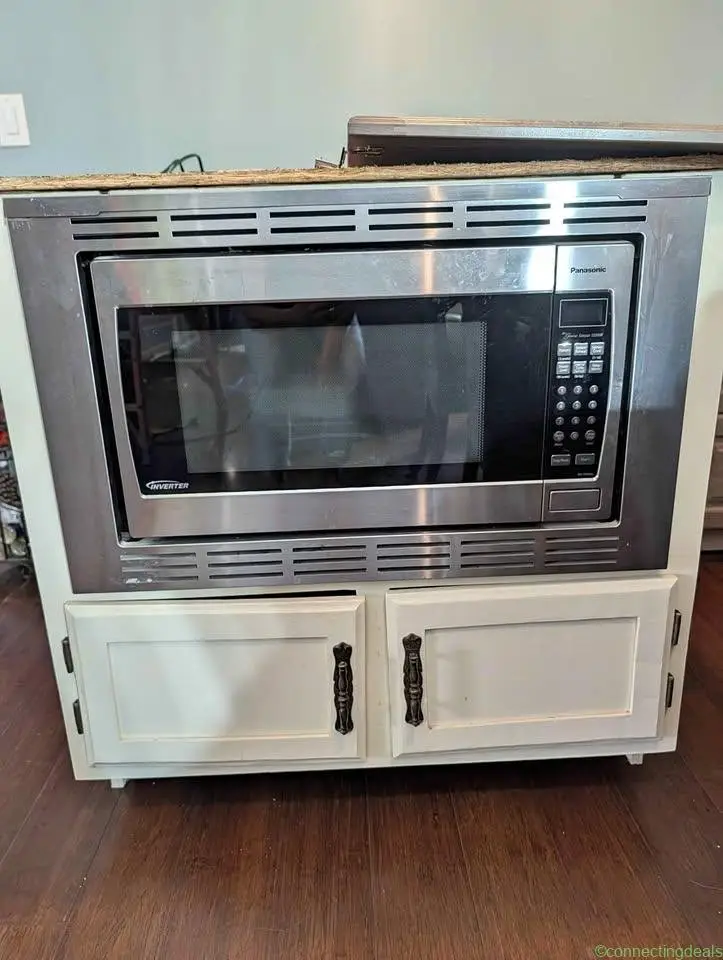 Microwave 1200 w in cabinet. - Image 1