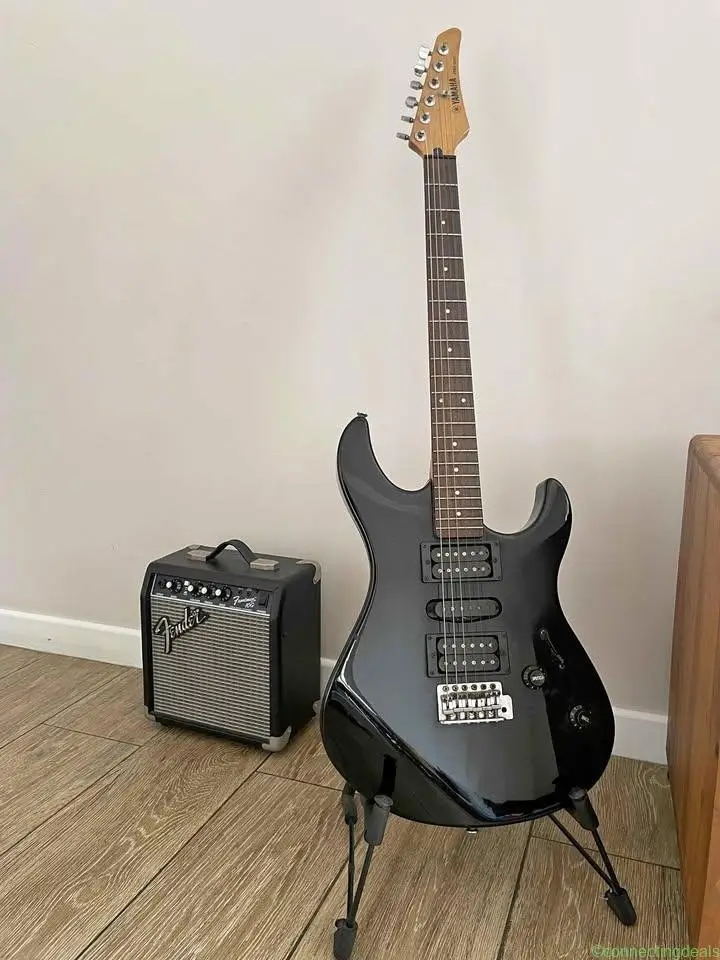 Yamaha electric guitar and fender amplifier in
