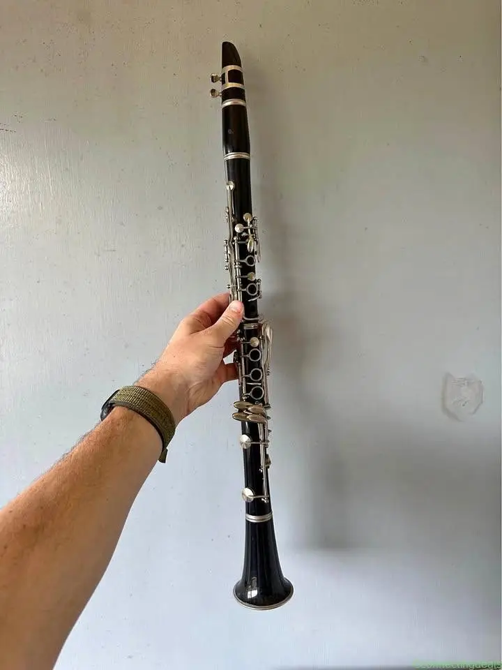 Old clarinet with bag and sheet music stand