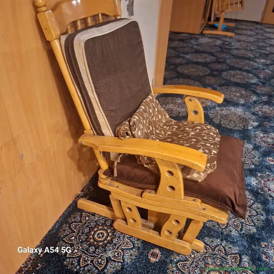 classic wooden glider rocking chair featuring a