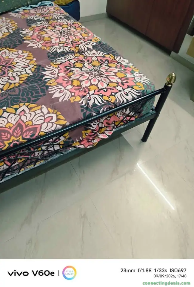 Steel cot with bed