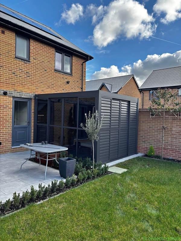 tilting louvred pergola. 3×3.6m. Grey with sides