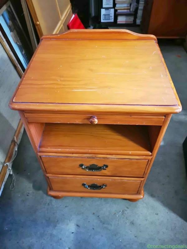 A pair of wooden bedside tables