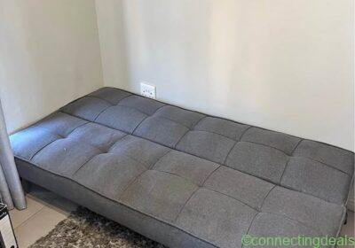 Grey fabric sofa (sleeper couch) in Johannesburg