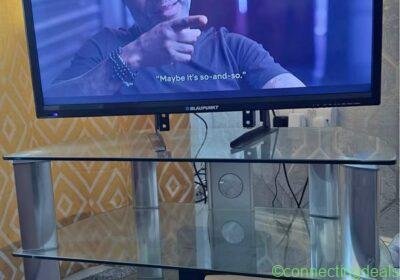 32 inch tv and tv stand in Manchester