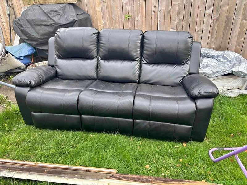 Black three seater recliner sofa