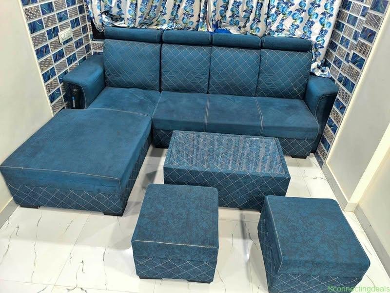 L shape sofa with centre table and 2 puffys