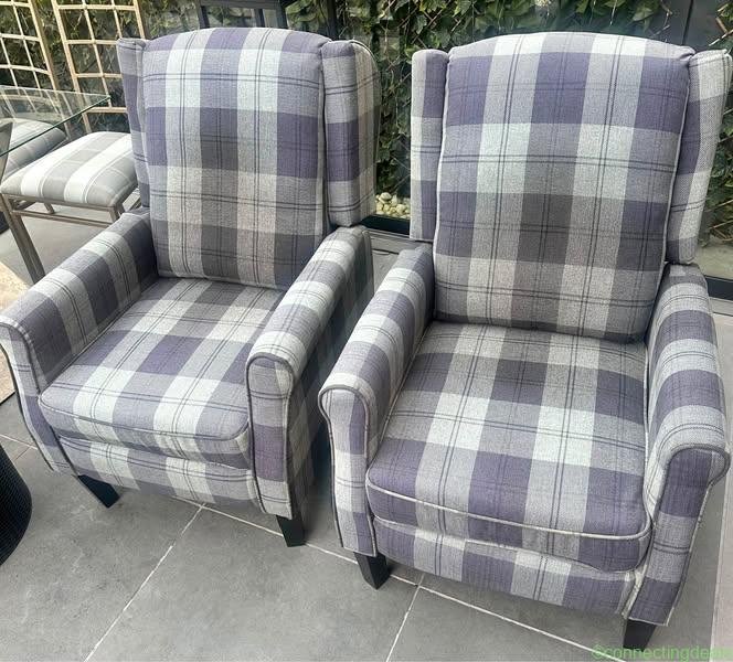 Two checked reclining armchairs