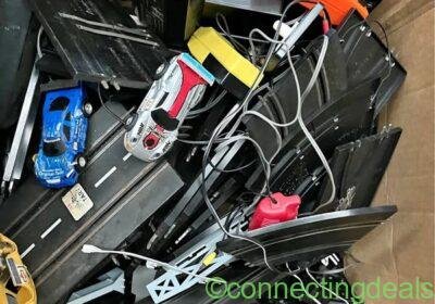 Box of race track controllers cars etc will need a clean up